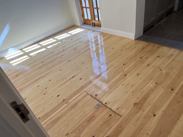 Pine floor sanded and refinished.